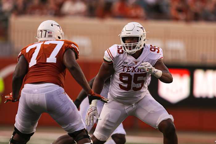 Texas defensive lineman Alfred Collins (95) rushes the quarterback during Texas's annual spring football game at Royal Memorial Stadium in Austin, Texas on April 23, 2022.